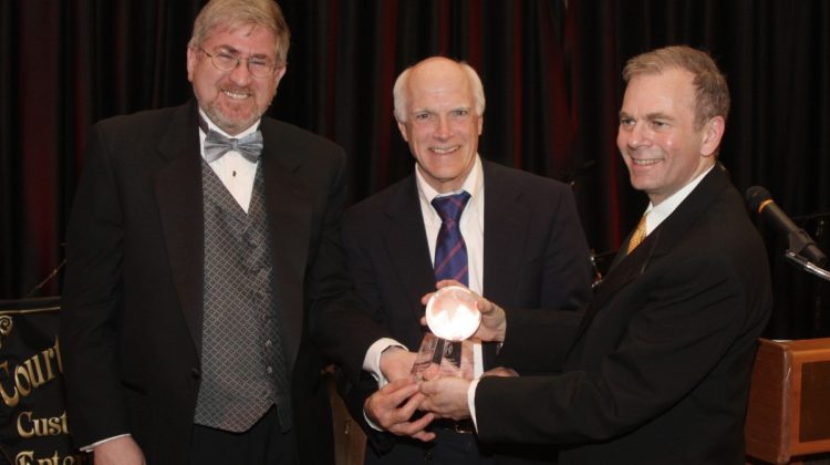 HBF Chairman Joel Rosen and HBF President Dr. Timothy Block present award to Dr. Brian McMahon